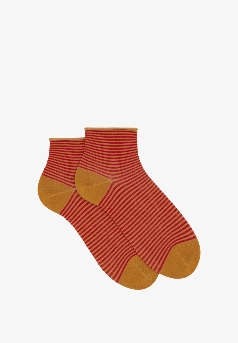 Striped ankle socks in rust red and mustard yellow, featuring vertical stripes, a soft texture, and a ribbed cuff design.