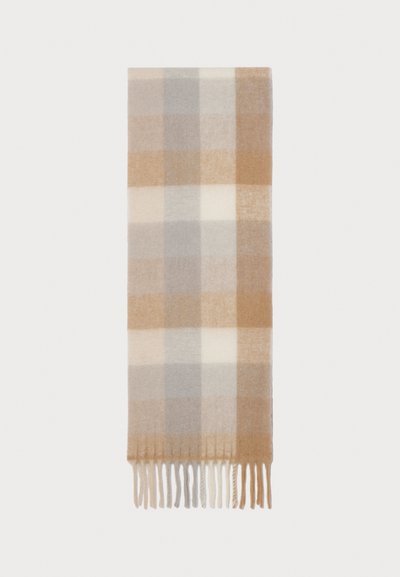 Wollschal im Plaid-Design mit großen Quadraten in Beige, Hellgrau und Creme, mit Fransen entlang der unteren Kante.