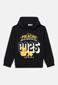 Sweat-shirt noir avec un motif frontal de Pikachu, portant un texte jaune "TYPE ÉLECTRIQUE" et "IL FAUT TOUS LES ATTRAPER !" au-dessus du numéro 025.