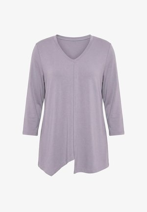 Lila lange mouwen V-hals top met asymmetrische zoom en zachte stof, getoond tegen een witte achtergrond.