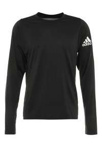 Pitkähihainen musta urheilupaita, joka on valmistettu sileästä ja kevyestä materiaalista. Paita sisältää pyöreän kaula-aukon ja valkoisen Adidas-logon oikeassa hihassa.