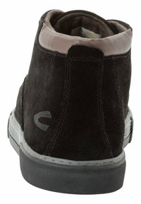 Black suede ankle boot with a rounded toe, smooth pink lining, gray accents, and a textured black rubber sole. Features a rear logo detail.