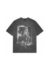 Gray oversized cotton t-shirt featuring a black and white graphic print of a face, with stylized text underneath. Short sleeves and crew neck.