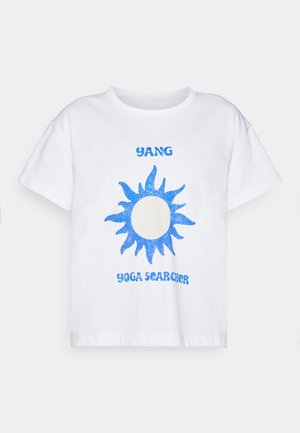 White cotton t-shirt featuring a blue glitter sun graphic and the text "YANG YOGA SEARCHER" in blue font. Short sleeves and relaxed fit.