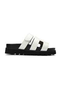 White slide sandal with two wide straps and a cut-out design, featuring a textured black outsole and adjustable fastening.