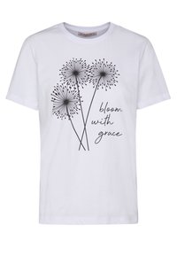 Camiseta de algodón blanca con un gráfico negro de tres formas similares a flores y el texto "florece con gracia" en una fuente elegante.