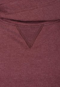 Maroon fabric with a textured, v-shaped accent at the neckline. Soft, casual design with stitching details along the edges.