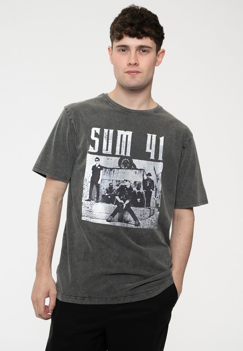 Gray cotton t-shirt with short sleeves and a round neckline, featuring a black and white graphic print of a band on the front.