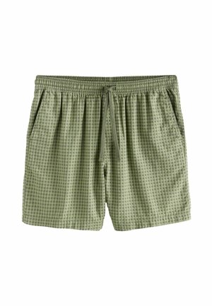 Jasnozielone szorty w kratę z elastycznym pasem, sznurkiem do wiązania i bocznymi kieszeniami, prezentowane na białym tle.