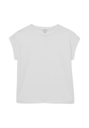 T-shirt bianca a maniche corte con scollo rotondo, vestibilità ampia e spalle leggermente abbassate, mostrata stesa su sfondo bianco.