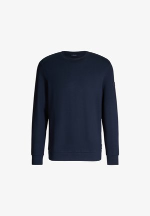 Marineblaue Sweatshirt aus Baumwolle mit langen Ärmeln, gerippten Bündchen und Saum. Mit einem Logo-Patch am Ärmel. Einfaches, minimalistisches Design.