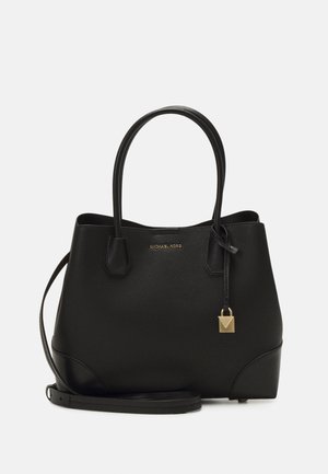 Sac à main noir Michael Kors avec deux poignées, une bandoulière détachable et un petit charm en forme de cadenas doré à l'avant.