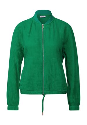 Veste bomber texturée verte avec une fermeture éclair à l'avant, des poignets élastiques et un ourlet réglable à cordon. Elle possède un col rond sans rabat.