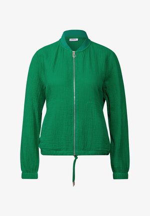 Green textured bomber jacket with a front zipper, elastic cuffs, and adjustable drawstring hem. Features a round neckline without a collar.