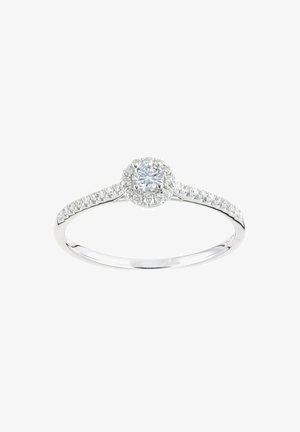 White gold ring with a round, brilliant cut diamond center, surrounded by a halo of smaller diamonds on a slender band.