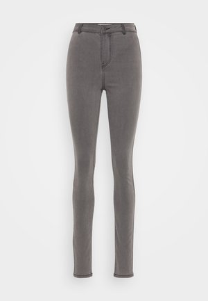 Sive jeans z visokim pasom, s skinny krojem, z zadrgo, enojnim gumbom in minimalnimi šivi ob šivih.