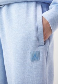 Jordan PANT - Pantalones deportivos - blue
