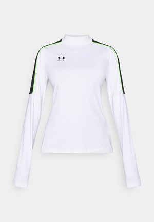 Ilgas rankovėmis sportinis viršus baltos spalvos su juodais ir žaliais akcentais; turi aukštą kaklo iškirptę ir aptakų siluetą, pagamintas iš sklandžios, tamprios medžiagos.