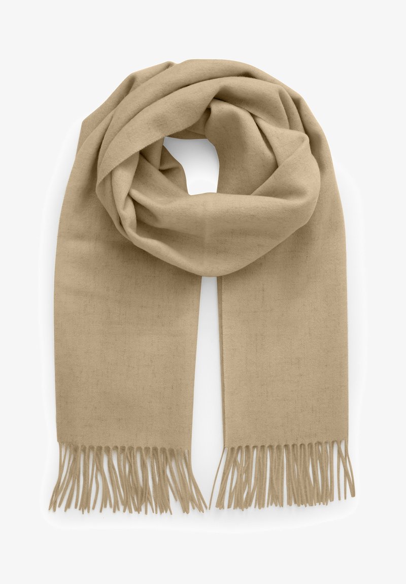Écharpe en laine beige avec extrémités à franges, pliée en boucle lâche.