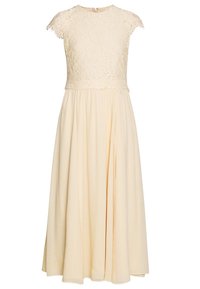 Krämfärgad klänning med spetsliv, kappärmar och flödande hopdraget kjol, med dragkedja bak.