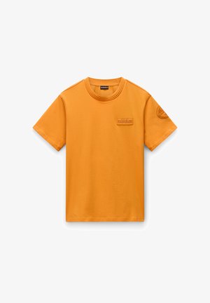Short-sleeve, crew-neck t-shirt in bright orange cotton. Features a textured patch on the chest and a round emblem on the sleeve.