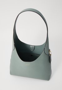 Green leather shoulder bag with a curved handle, smooth texture, and a small tag detail. The interior features a snap closure.