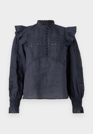 Mørk marineblå bluse med volanger på skuldrene, vertikale sømmer, blonde detaljer, knappelukking og smockede mansjetter. Lett, teksturert stoff.