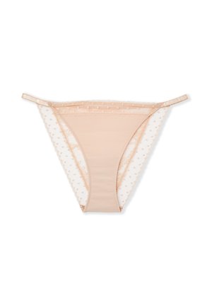 Jasnobeżowy string z gładkim przednim panelem, przezroczystymi bokami z siateczki w groszki, falbanką z koronki i cienkimi, regulowanymi ramiączkami.