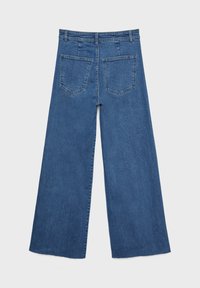 Siniset leveälahkeiset farkut, joissa on korkea vyötärö, kaksi takataskua ja teksturoitu kangas, kuvattuna takaapäin.