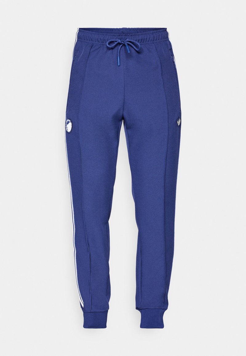 Marineblaue Sweatpants aus weichem Stoff, mit weißen Seitestreifen, elastischem Bund mit Kordelzug und Logodetail am linken Bein.