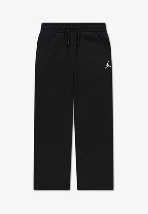 Calças de fato pretas feitas de tecido macio, com um corte descontraído, cintura elástica com cordão e um logotipo branco no lado esquerdo.