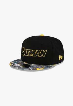 Black snapback cap with yellow "BATMAN" text on front and patterned gray, yellow, and white brim featuring Batman-themed designs.