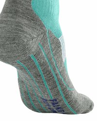 Szara skarpetka z akcentami w odcieniu teal i teksturowanym materiałem, wyeksponowana na boku, podkreślająca kształt i detale projektu.
