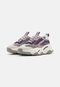 Sneakers featuring a mix of light gray suede and mesh with purple accents, thick white rubber sole, and gray traction outsole.