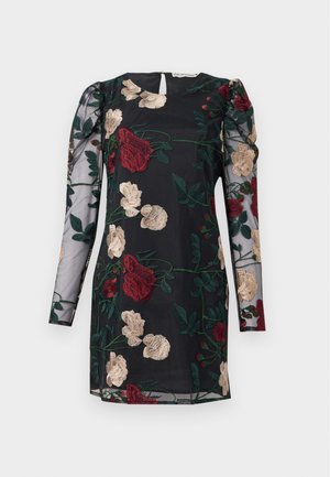 Musta mekko, jossa on pitkät, läpinäkyvät hihat, joissa on monimutkaista kukka-arkkitehtuuria punaisena, kultaisena ja vihreänä, sekä pieni avaus takana.
