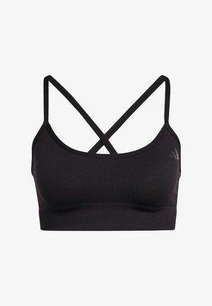 Reggiseno sportivo nero senza cuciture con sottili spalline incrociate e fascia a coste, progettato per un supporto medio durante le attività fisiche.