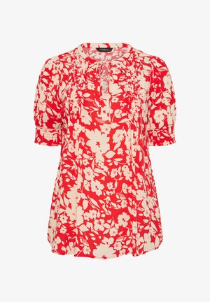 Blusa de manga corta con estampado floral en rojo y blanco, con detalles de piedritas y un escote con lazo frontal.