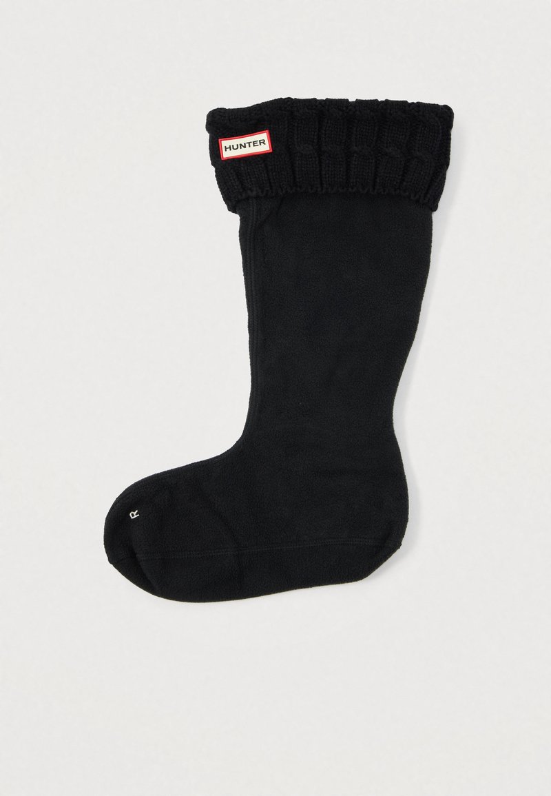 Melnas frotētas zeķes ar ribota trikotāžas aproci; dodās sarkans un balts "HUNTER" logos uz aproces. Gluda tekstūra, silts dizains.