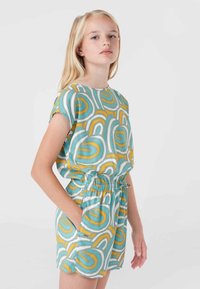 Kurzärmliger Jumpsuit in Teal-, Gelb- und Weißmustern. Elastischer Bund, lässige Passform, mit Seitentaschen und glattem, leichtem Stoff.