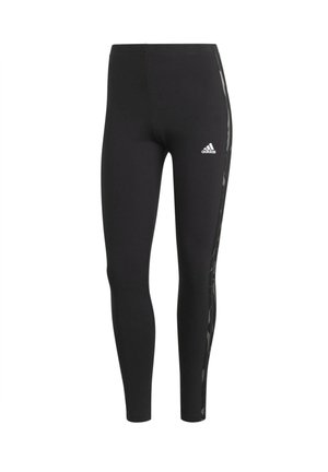 Leggings Adidas neri a tutta lunghezza con una sottile banda laterale e logo Adidas bianco sulla coscia sinistra.