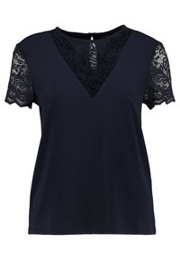Navy blue t-shirt with short lace sleeves and a V-neckline. The lace features a floral pattern, adding texture to the smooth fabric.