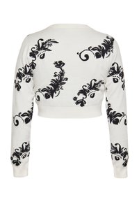 Pulover scurt din tricot alb cu broderie florală neagră. Are mâneci lungi și un decolteu rotund cu margine ribbată.