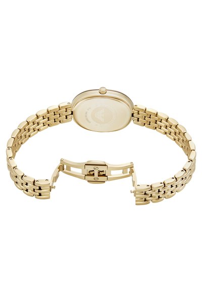 Goldenes Metallarmbanduhr mit rundem Gehäuse, verlinktem Banddesign und Klappverschluss. Die Rückseite weist gravierte Details auf einer glatten Oberfläche auf.