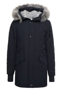 Mörkblå parka med fur-fodrad huva, vadderad innerfoder, framknappar, klafffickor och ribbade handledskjortor.