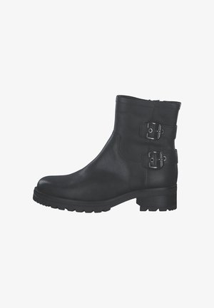 Bottines en cuir noir avec un bout arrondi, deux accents de boucle en métal sur le côté, une finition texturée et une semelle en caoutchouc épaisse.