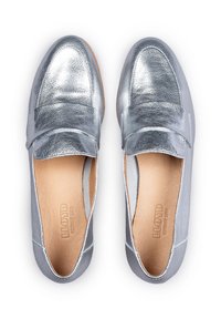 Silver metallic loafers with a smooth texture and rounded toe. Features a wide strap across the front and a leather insole.