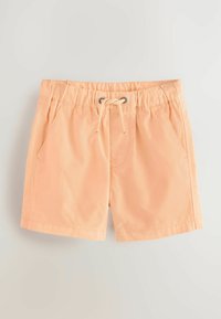 Pfirsichfarbene Shorts aus weichem Stoff, mit einem elastischen Bund und Kordelzug, sowie zwei seitlichen Taschen. Einfaches und unauffälliges Design.