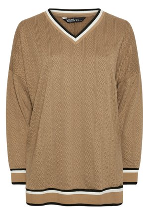 Pull en V brun avec un motif en zigzag texturé, manches longues, et des rayures noires et blanches en contraste au niveau de l'encolure et de l'ourlet.