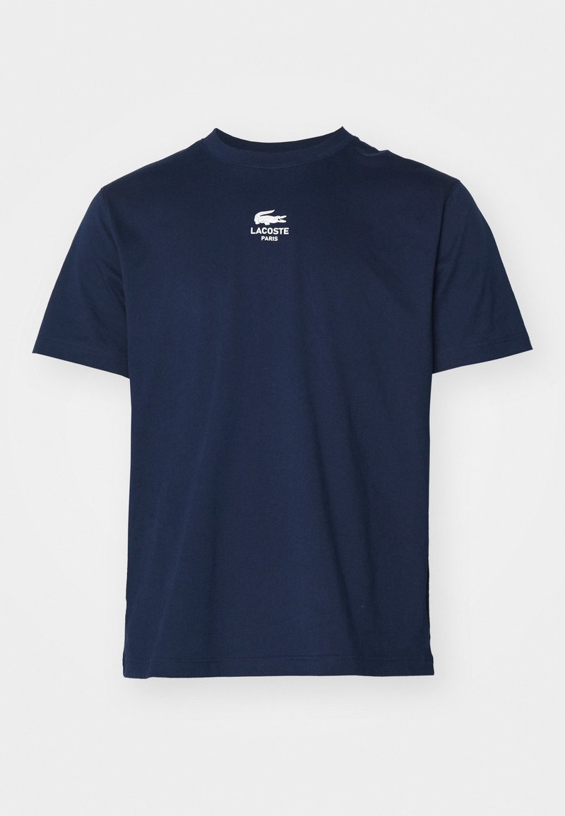 Navy blue cotton t-shirt with a crew neck, short sleeves, and Lacoste logo printed in white on the chest, featuring a smooth texture.