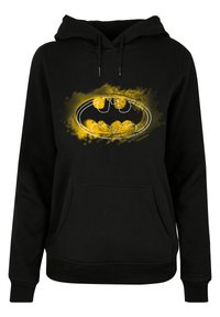 Black hooded sweatshirt featuring a large, yellow Batman logo with a splatter design in the background. Includes a front kangaroo pocket.